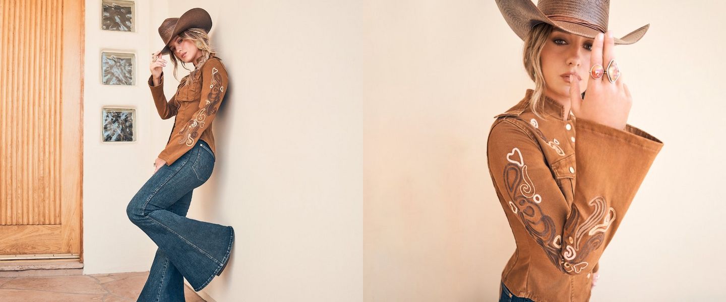 Lainey Wilson wearing a suede jacket and cowboy hat