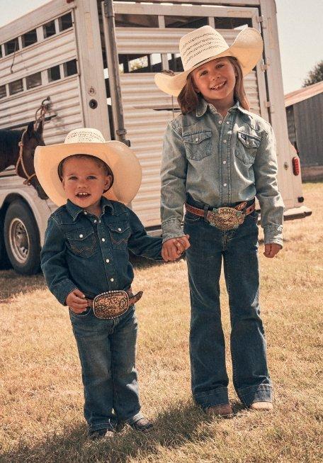 a boy and girl holding hands wearing Wrangler denim on denim