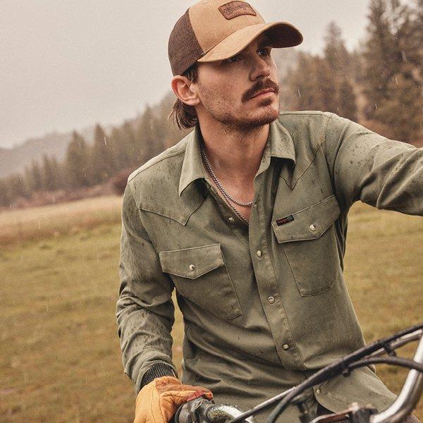 Tucker Wetmore riding a dirtbike, looking off camera - Shop All Terrain Gear