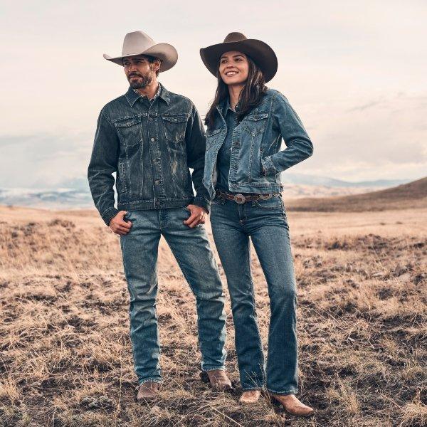 man and woman wearing full denim on denim with cowboy hats