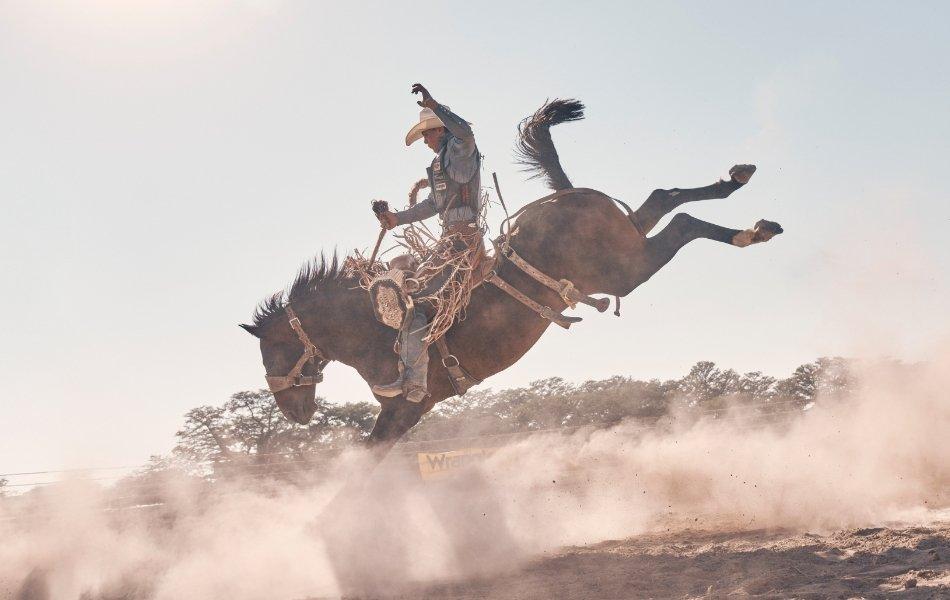 Team Wrangler athlete Cooper Lane riding a bucking bronco.