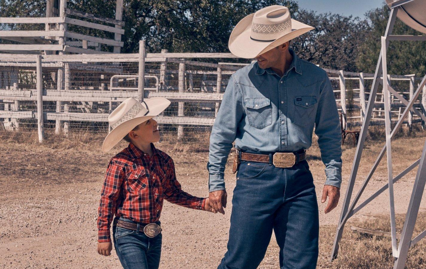 Father and son holding hands and walking
