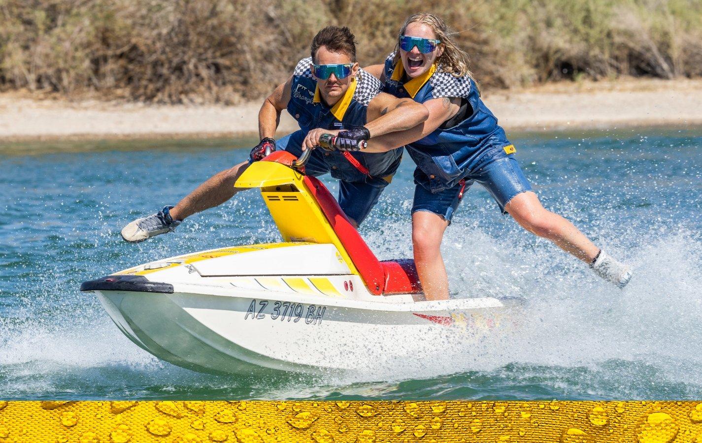 couple on jetski wearing Wrangler x Pit Viper clothing