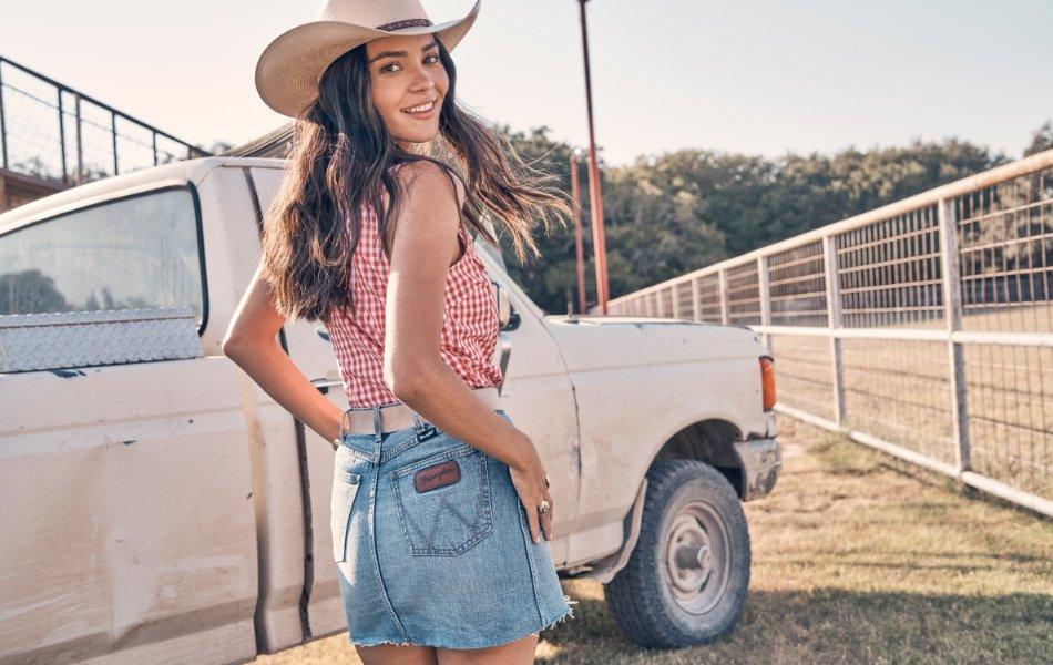 girl in cowboy hat looking back at the camera