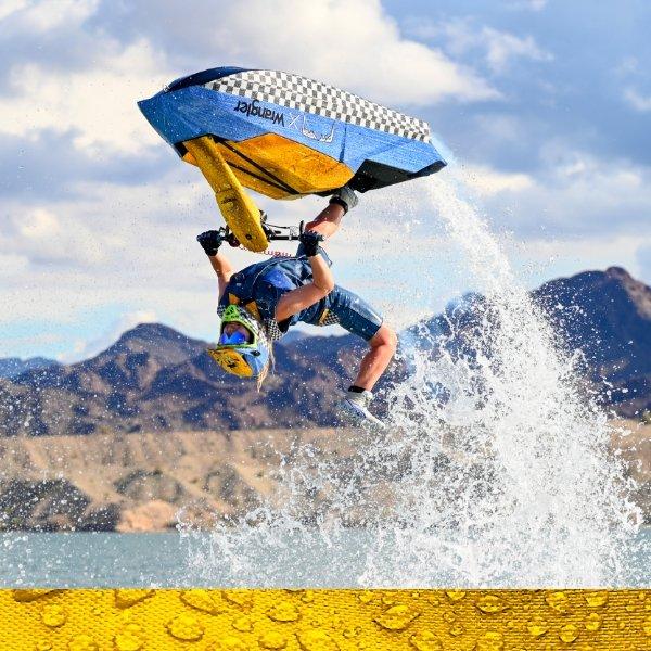 person doing a jetski trick wearing Wrangler X Pit Viper clothing