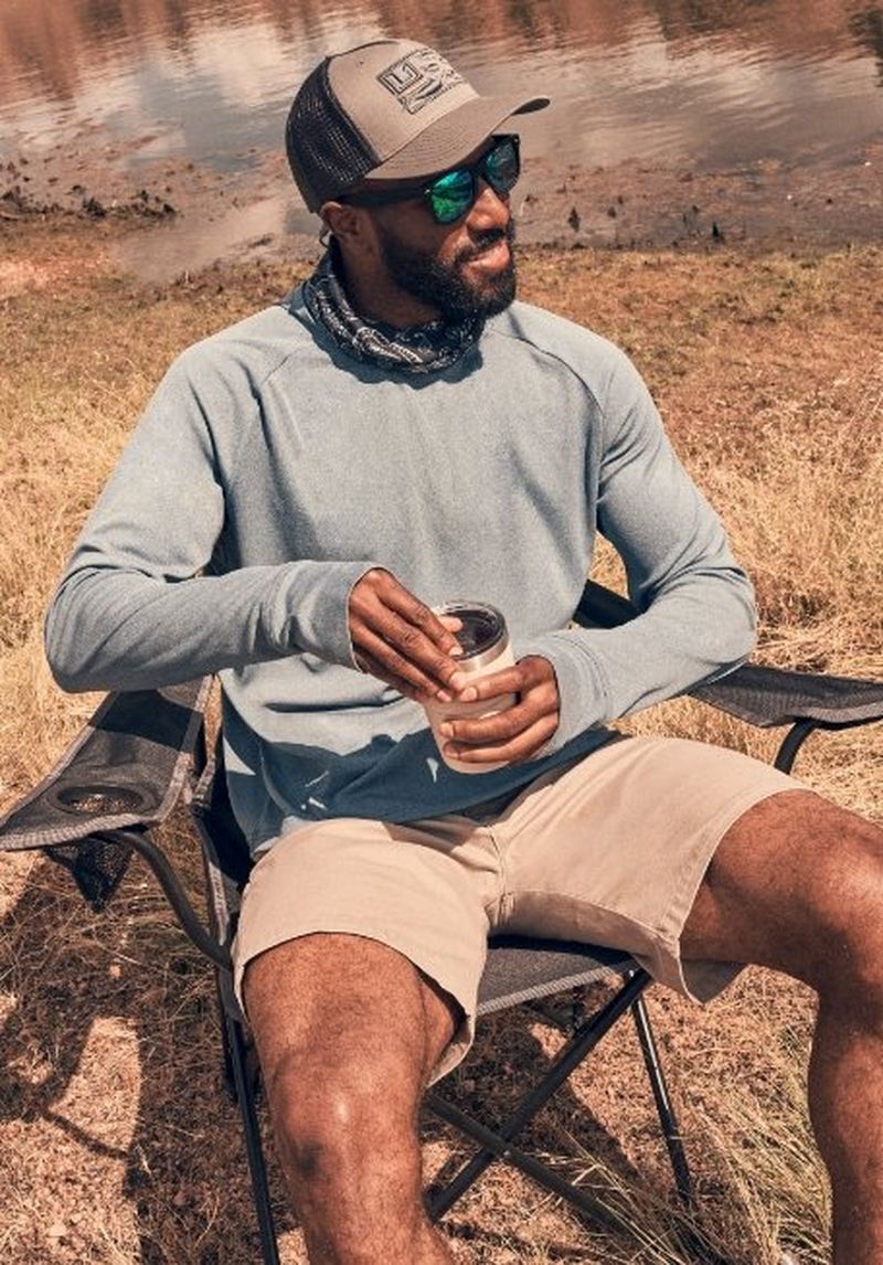 Guy sitting in a chair by the lake - Shop Shorts