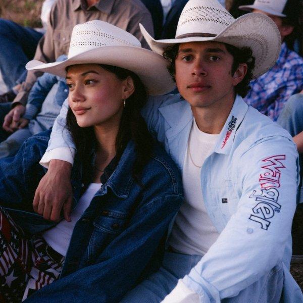 man and woman wearing Wrangler red, white and blue apparel and cowboy hats