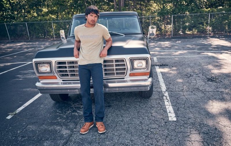 Guy leadned up against the hood of a vintage truck - Shop Slim Fit
