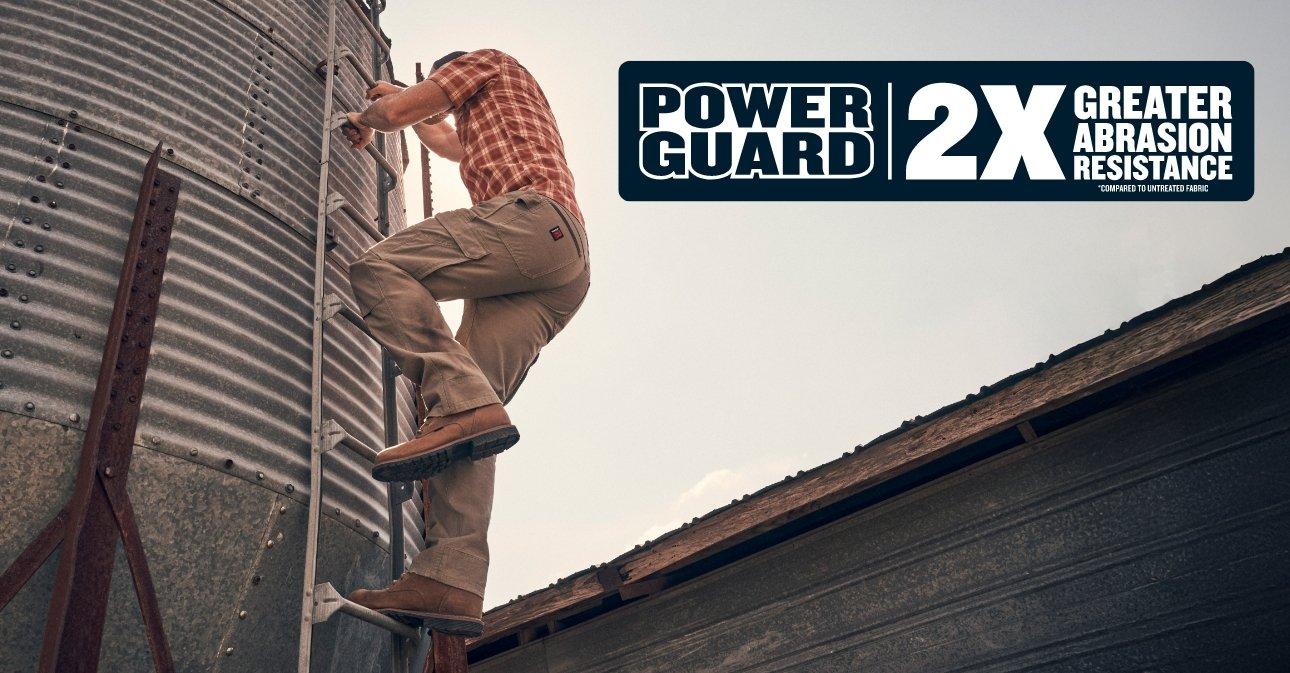 man climbing up silo wearing Wrangler Workwear featuring PowerGuard