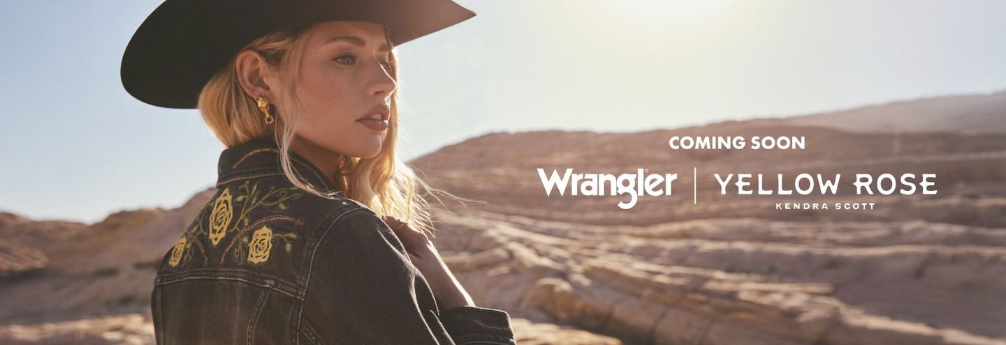 Woman with blonde hair wearing black cowboy hat and Wrangler x Kendra Scott jacket.