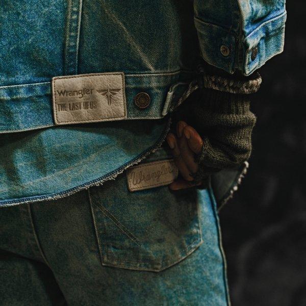 Guy wearing wrangler jeans and The Last of Us denim jacket