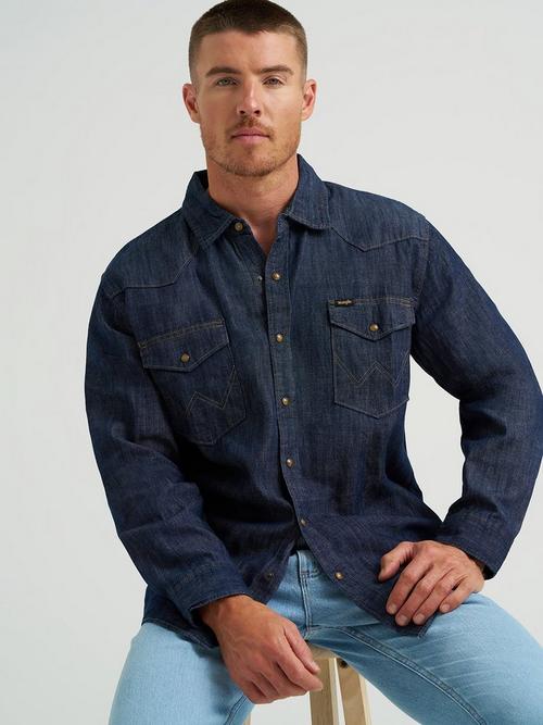 Man wearing long sleeve Wrangler light wash denim shirt 