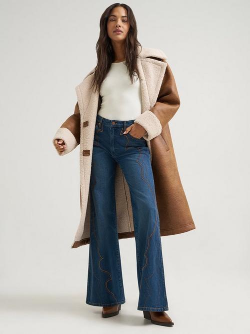 Women wearing Wrangler flare jeans