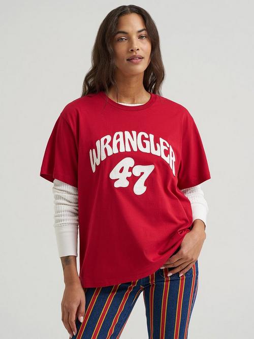 Women wearing wrangler white graphic tee