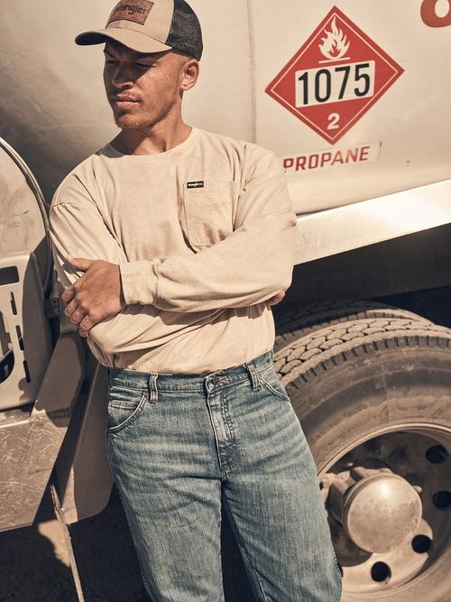 Photo of a man wearing Wrangler fire resistant gear