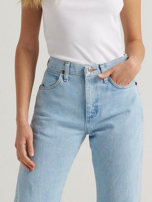A women's torso showing super high rise Wrangler jeans