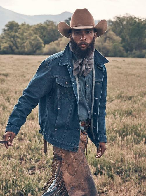 Man Riding a horse wearing a Wrangler western denim jacket 