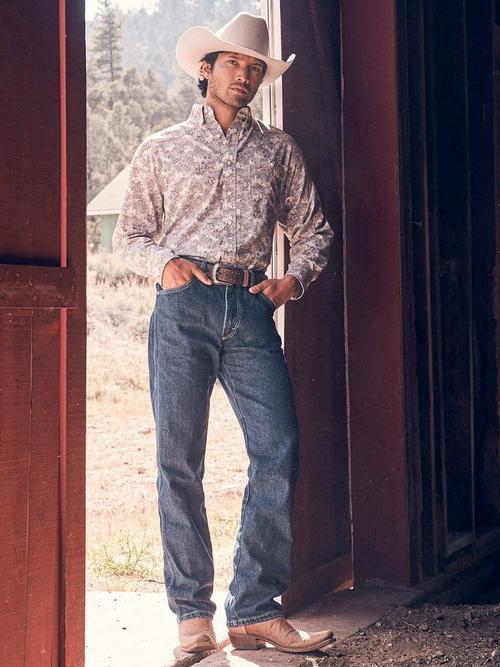 Man walking wearing Wrangler retro western jeans