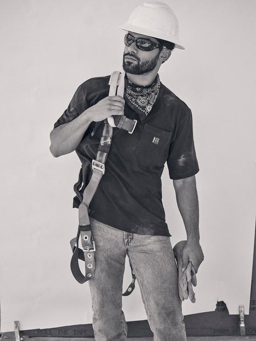 Black and White Photo of a Man in a Hard Hat